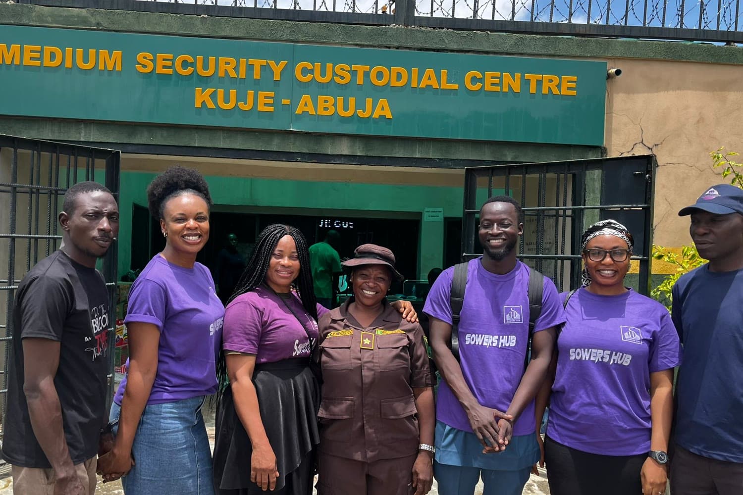 The SowersHub team with a correctional officer outside Medium Security Custodial Centre, Kuje, Abuja